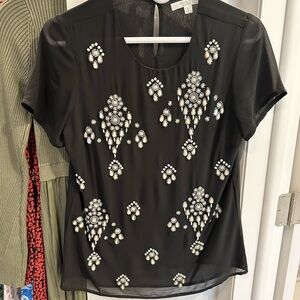 Piperlime black top with pearl details, size XS.